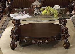 A bob timberlake glass top cherry wood coffee table that features deep drawers and one velvet lined drawer that opens on either side with a locking feature. Versailles Round Glass Top Coffee Table In Cherry Oak Finish By Acme 82080