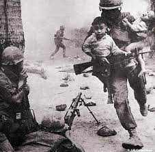 A U.S. Marine rescues two Vietnamese children during a gun battle at the  city of Hue, during the Tet Offensive of the Vietnam War - 1968 [460 x 345]  : r/HistoryPorn