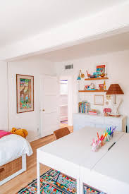 A queen bed with two nightstands for full functionality. How We Created A Home Office Guest Room Studio Diy