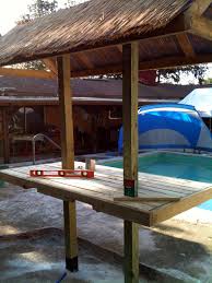 Poolside Tiki Island Table Oasis Completely Built From Recycled Wooden Pallets Except Three Beams The Roof Cov Outdoor Tiki Bar Outdoor Backyard Pool Decor