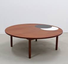 Danish modern fish tail teak surfboard coffee table with rack $ 1,850; Large Mid Century Round Danish Coffee Table By Hans Per Jeppesen 79783