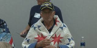 12 Dot Food employees honored with quilts for their military service