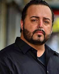 My very first headshot 2014! I just lost everything and was living with my  younger brother. Couldn't afford headshots, so I took this myself and used  a filter. When I started booking,