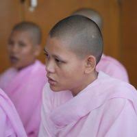 Buddhist Monks pray during the festival's opening ceremony