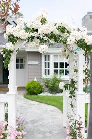 White vinyl spaced picket fence gate (sold separately). Front Gate Arbor Traditional Home Exterior
