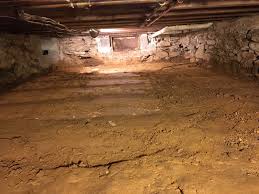 Additional footings, posts, and beams are installed; An Old Farm Crawl Space Dig Done