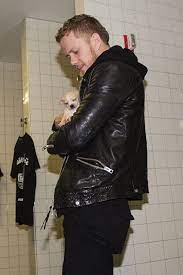 Dan Reynolds Of Imagine Dragons Holds A Pupppy Brought By Motley Zoo Animal Rescue Backstage During Deck The Hall Ball Hos Dan Reynolds Imagine Dragons Imagine