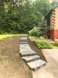 Finally, place bark around the flagstone, then sweep it off. Patios And Walkways Elf S Landscaping