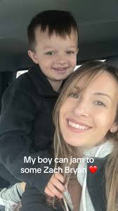 Little Boy Singing with Mom in A Truck