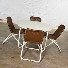 This stylish chair combines leather, iron, and chrome to create a comfortable midcentury seating option for any room. Mid Century Modern Samsonite Round Patio Dining Table And 4 Folding Sling Chairs Warehouse 414