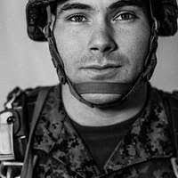 Private First Class Jassett Jones uses a buccal (cheek)