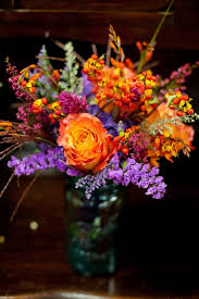Make a statement at your wedding, whether you go with full, bright bursts of orange, oranges and whites, orange and purples, a bright orange bouquet with a… Real Wedding A Purple And Orange Wedding Wedding Flowers Purple Wedding Flowers Orange Purple Wedding