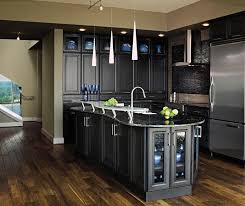 Steamed milk, and other light creamy colors, are great choices to pair with honey oak cabinets if you want to moderate the tones in the wood. Dark Grey Kitchen Cabinets Masterbrand