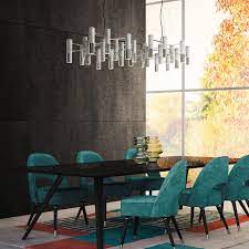 If you want contemporary glamor, coordinate metallic modern dining chairs with the chandelier for an overall chic effect. 5 Modern Dining Chairs That Are A Dream To Sit On