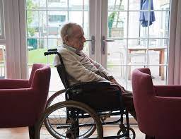 Elderly Man In A Wheelchair by Science Photo Library