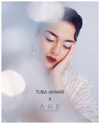 The gorgeous #AreGirl @syedatuba in timeless 'Whimsical Swan'. Romance with  our sleeveless raw silk dress, where delicate hand-embellishments dance  along the sides. Finished with a stone-studded cape and eco-conscious  strings, its elegance