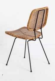 Dirk Van Sliedrecht Enameled Metal And Rattan Chair For Rohe Noordwole 1950s Elle Decoration Nl Rattan Armchair Rattan Chair Rattan Dining Chairs