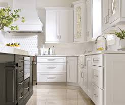 We're seeing white cabinets with gray islands pop up everywhere. White Kitchen Cabinets With A Dark Grey Island Masterbrand
