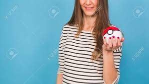 Ufa, Russia - July 8, 2017: Woman Holding Pokeball. Pokemon Go Multiplayer  Game With Elements Of Augmented Reality. Catching The Vaporeon Pokemon  Stock Photo, Picture and Royalty Free Image. Image 82785400.
