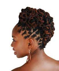 Make your beautiful brown locks stand out with a sophisticated twisted low bun. How To Use Coconut Oil For Hair Amazing Moisturizer With Images Locs Hairstyles Dreadlock Hairstyles Natural Hair Styles