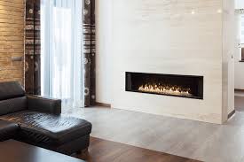 The metal fireplace surround is not plumb with the drywall after removing the moulding and tiling, and sits out about a half an inch or so next to the drywall. L3 Linear 66inch Gas Fireplace