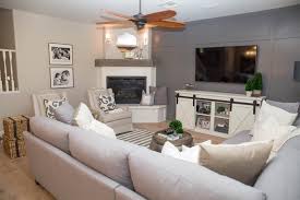 A Large Sectional And Two Chairs Give This Cozy Living Room Plenty Of Seatin Large Living Room Layout Corner Fireplace Living Room Sectional Living Room Layout