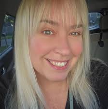 Who can recommend a dog sitter for drop-in visits in Traverse City at the  end of May?