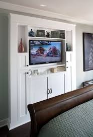 The home offers a fireplace and a tv, alongside the primary bedroom featuring a classy bed setup lighted by lovely table lamps on both sides. Image Result For Master Bedroom Narrow Built Ins Around Fireplace Small Bedroom Remodel Small Master Bedroom Remodel Bedroom