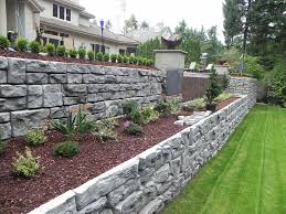 This retaining wall is meticulously built with a repeating pattern and precise measurements. 6 Gorgeous Retaining Wall Ideas Forgardening