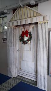 Acient Greek Temple Door Display With A Christmas Wreath Door Decorations Door Displays Decor