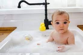 Last week when we were visiting my husband's cousins my lo was playing with their… Top 10 Baby Bathing Tips Kitchen Sink Baby Bath