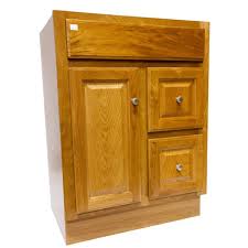 Boasting a solid neutral finish features two drawers and one cabinet for keeping crisp towels, cleaning supplies, and other bathroom essentials. 24x18 Regal Oak Vanity With Drawers Heeby S Surplus Inc