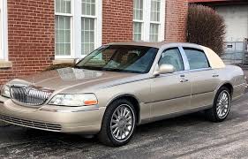 Image result for Medium Gold 1998 Town Car
