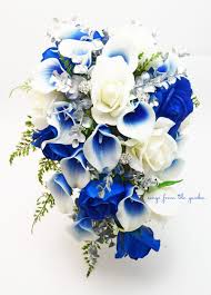 Dahlias, garden roses, silver dollar eucalyptus. Cascade Bridal Bouquet Silver Blue White Picasso Callas Real Touch Royal Blue Roses Rhinestones Add Groom S Boutonniere Bridesmaid Blue Wedding Bouquet Bridal Bouquet Blue Blue Wedding Flowers