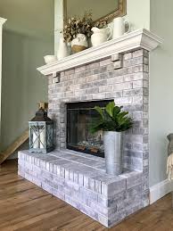 My brick fireplace before paint: How To Whitewash A Brick Fireplace This Hiatus