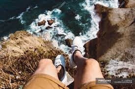 Looking Down View Of Male Standing On Edge Of Coastal Cliff Body Part Stones Stock Photo 176559838
