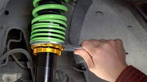 It is especially important to know the distance between the upper and lower mounting points at ride height. How To Adjust Coilovers Raceland