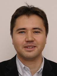 Score Calibration in Face Recognition