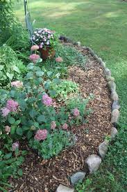 Edging Your Country Garden In Fieldstones Landscaping With Rocks Garden Border Stones Stone Landscaping