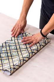 Open the bottom end so the inside of the paper is revealed. Make A Wrapping Paper Gift Bag