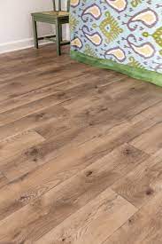 Vinyl tiles work great in the yes, all vinyl flooring products are waterproof because they're composed primarily of pvc. Why We Installed Select Surfaces Laminate Floors In Our Basement Jeweled Interiors