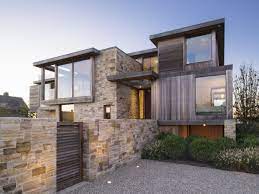 Ein haus aus stein für sie allein, so mussten sie nicht darben. Ein Haus Mit Verschachtelter Fassade Aus Stein Holz Und Glas Fassadengestaltung Fassade Klinker Fassaden Gestaltung