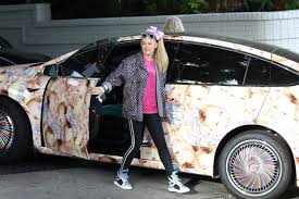 She's also talks at the speed of light. Jojo Siwa S Car Is Covered Entirely With Pictures Of Her Own Face