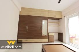 wooden laminate is getting elegant finishes in the operable wardrobe wardrobe design interior in 2020 interior design companies design maker luxury design