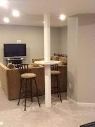 Do you have ugly metal poles in your basement wondering what to do with them? Basement Bedroom No Windows Basementremodellighting Basementbathroomcolors Basement Poles Basement Pole Covers Basement Pole Wrap