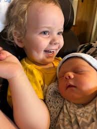 Kat Timpf introduces her baby to the group