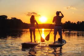 Maybe you would like to learn more about one of these? A Silhouette Of A Couple On A Stand Up Paddle Boards Sup At Sunset On Lady Bird Lake In Austin Texas Photograph By Austin Welcome Center