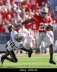 Ohio State's Chris "Beanie" Wells, right, tries to run past Purdue's Dwight  McLean during an NCAA football game Saturday, Oct. 11, 2008, in Columbus,  Ohio. (AP Photo/Jay LaPrete Stock Photo