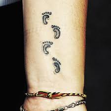 Baby footprint tattoos can be made on any part of the body. Black Ink Footprints Tattoo On Wrist