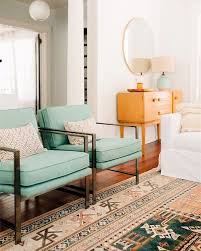 Sea Foam Mid Century Style Chairs With A Boho Style Rug With Teal And Peach Tones Lo Mid Century Modern Living Room Mid Century Living Room Living Room Modern